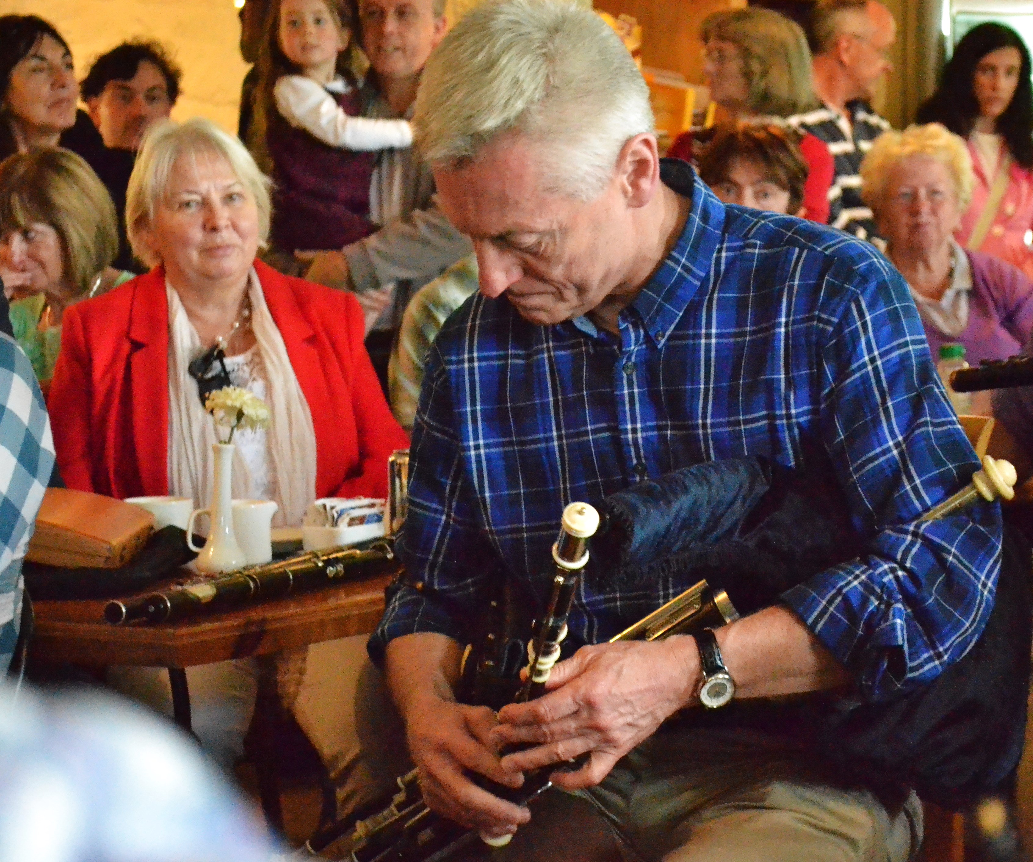 Mick O'Brien performing a solo at The Mills Sunday 18th May 2014 with Olivia Rowsome Grimes in the background.